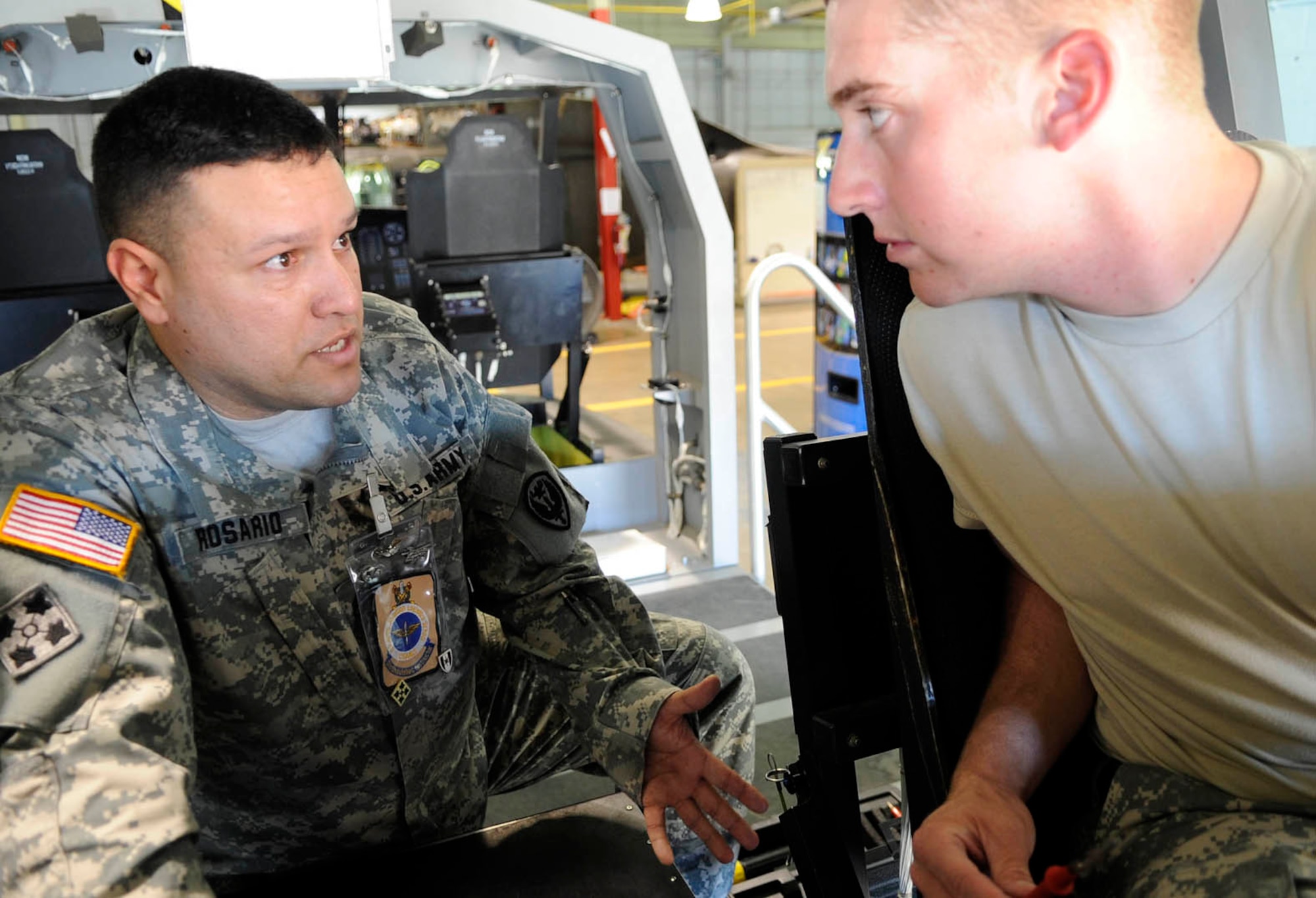 Staff Sgt. Ernesto Rosario, U.S. Army Aviation Logistics School military instructor, electronics division, teaches a Solider during an evaluation course at Fort Eustis Oct. 18. Rosario received the honor of being named USAALS military Instructor of the Year for his hard work and dedication to the instructor community. (U.S. Air Force photo by Staff Sgt. Dana Hill/RELEASED)