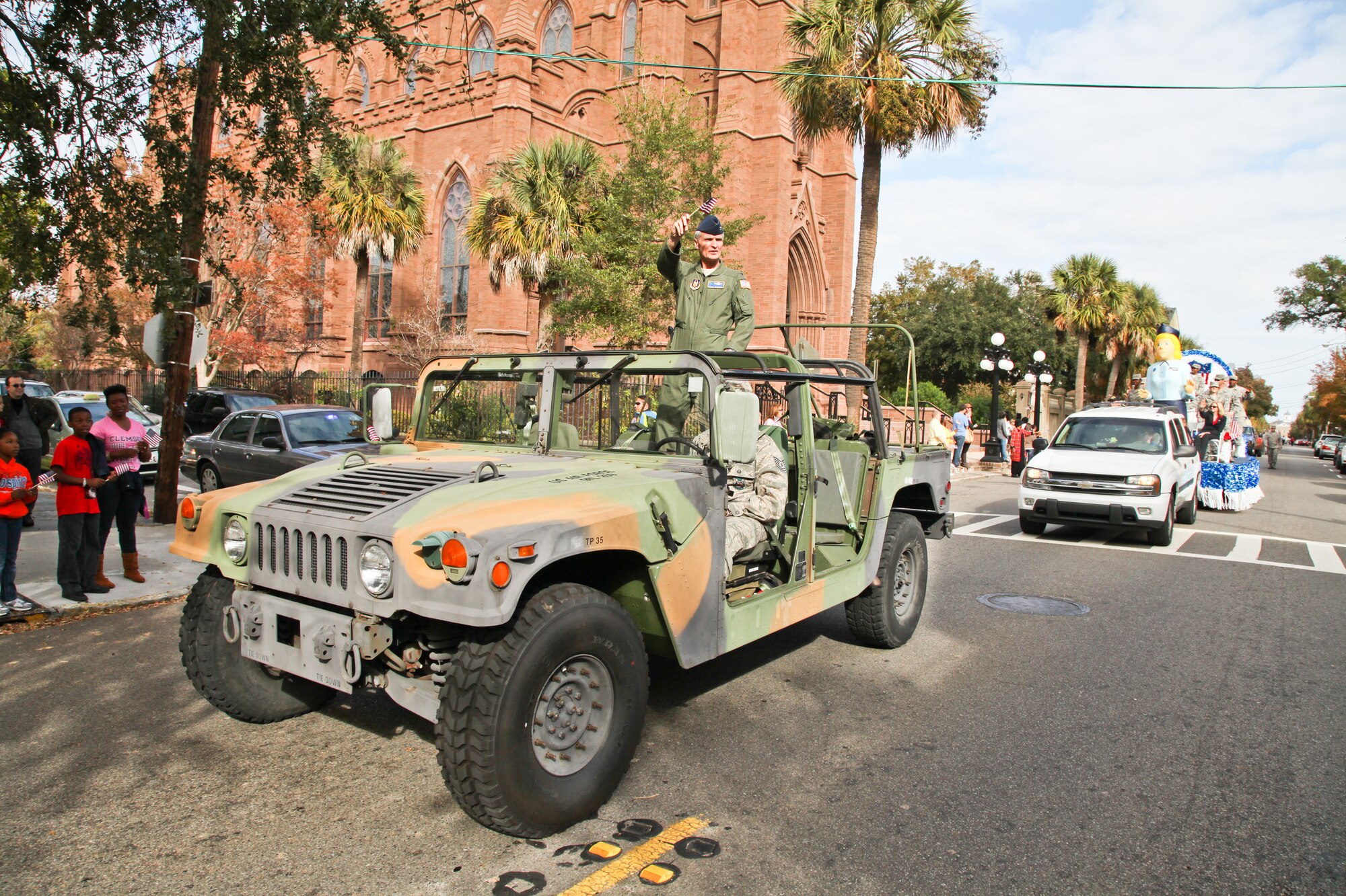Col. Steven Chapman, commander of the 315th Airlift Wing waves at onlookers during annual Charleston Veteran's Day parade.  (U.S. Photo/Staff Sgt. Rashard Coaxum)