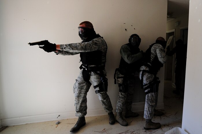 Senior Airman Jonathan Garrett clears a room with his team during Close Quarters Battle Training at Joint Base Charleston - Air Base, Nov. 1. CQB training prepares security forces personnel to handle hostage situations or a threat that is within close range.  Garrett is with the 628th Security Forces Squadron.  (U.S. Air Force photo/ Staff Sgt. Nicole Mickle) 