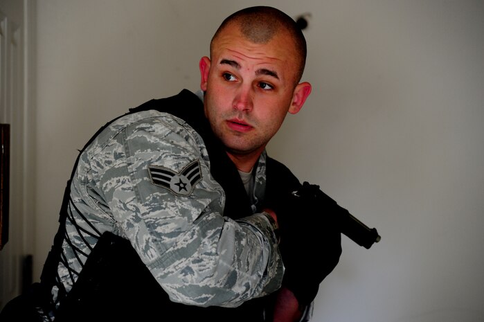 Senior Airman Jonathan Garrett clears a room with his team during Close Quarters Battle Training at Joint Base Charleston - Air Base, Nov. 1. CQB training prepares security forces personnel to handle hostage situations or a threat that is within close range. Garrett is with the 628th Security Forces Squadron.  (U.S. Air Force photo/ Staff Sgt. Nicole Mickle) 