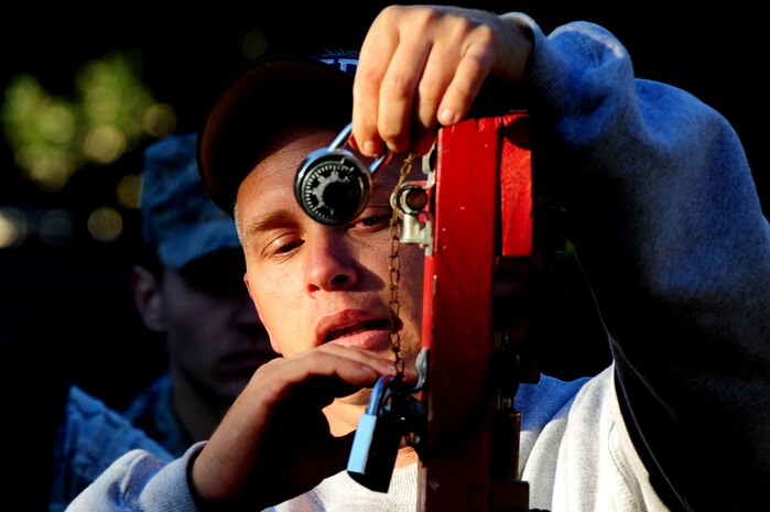 During the Close Quarter Battle Training brief at Joint Base Charleston - Air Base, Nov. 1, Ed Henry explains the different types of locks 628th Security Forces Squadron members may encounter while performing their duties. CQB training prepares security forces members to handle hostage situations or a threat that is within close range. The Charleston Fire Department joined the 628th SFS to provide training on effectively breaching doors and to conduct other non-conventional entry and exit techniques. Henry is with the Charleston Fire Department.  (U.S. Air Force photo/ Staff Sgt. Nicole Mickle)    