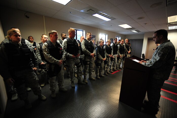 Staff Sgt. Neil White delivers a safety brief to members of the 628th Security Forces Squadron before Close Quarters Battle Training at Joint Base Charleston - Air Base, Nov. 1. CQB training prepares security forces personnel to handle hostage situations or a threat that is within close range. The Charleston Fire Department joined the 628th SFS to provide training on effectively breaching doors and to conduct other non-conventional entry and exit techniques. White is a trainer with the 628th SFS.  (U.S. Air Force photo/ Staff Sgt. Nicole Mickle) 