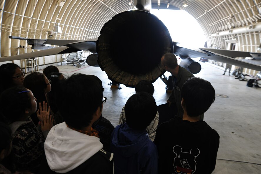 1st Lt. Shayne Carroll, 35th Fighter Squadron pilot, gives students participating in the 8th Fighter Wing Honorary Pilot Program a tour of an F-16 Fighting Falcon at Kunsan Air Base, Republic of Korea, Nov. 4, 2011. The program gave students a glance of what an F-16 pilot?s life is like here at Kunsan. They were able to receive a tour of an F-16 static display, F-35 Lighting II simulation, tour of the base tower, tower simulation, 35th Fighter Squadron tour and participated in hands on activities. (U.S. Air Force photo by Senior Airman Brittany Y. Auld/Released)
