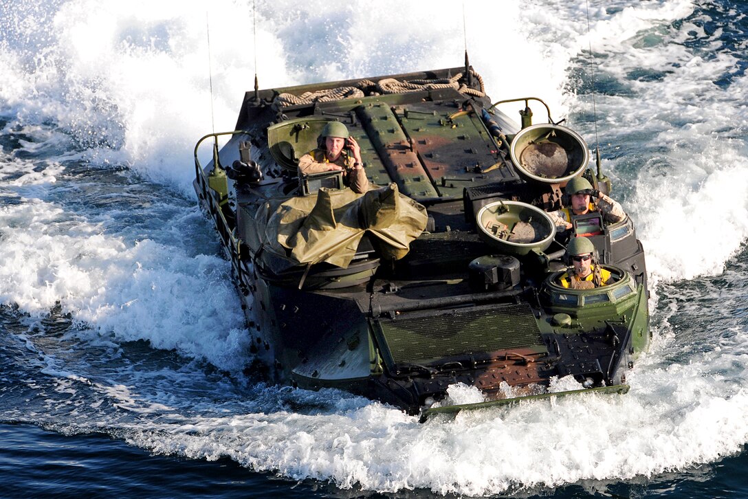 An amphibious assault vehicle approaches the USS Makin Island in the Pacific Ocean, Nov. 1, 2011. The Marines are assigned to the 11th Marine Expeditionary Unit. Makin Island is underway for routine operations off the coast of Southern California in preparation for the ship's first operational deployment later this year.
