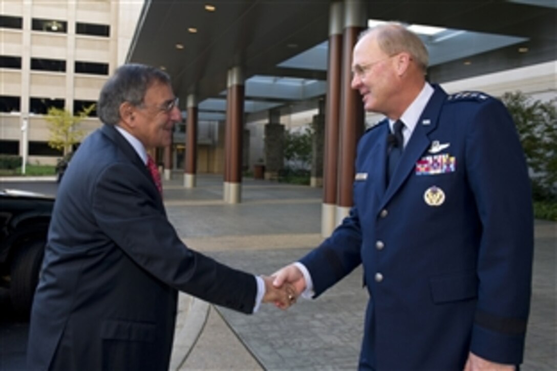 Defense Secretary Leon E. Panetta, left, greets Air Force Gen. Craig R. Mckinley, chief of the National Guard Bureau, at the National Guard Joint Leadership Conference in National Harbor, Md., Nov. 8, 2011. 