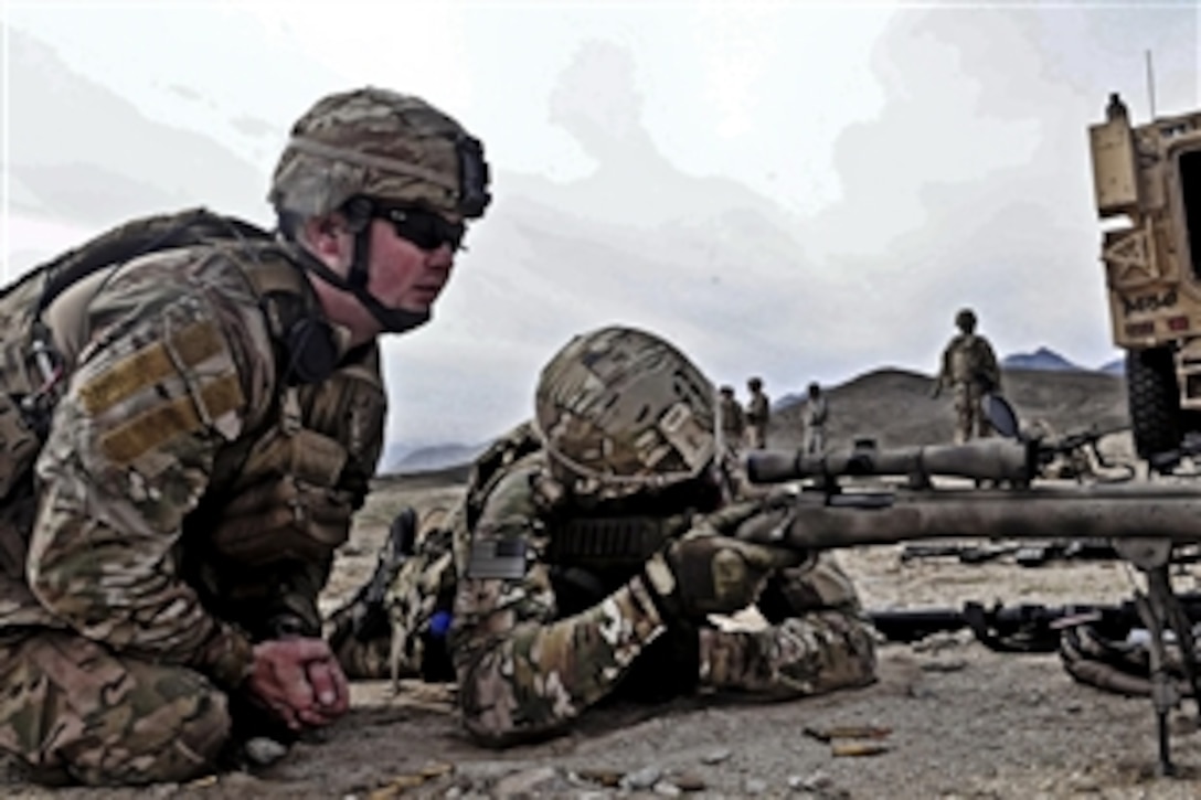 U.S. Army Sgt. Lucas Simmons, left, observes as Air Force Staff Sgt. Abner Cornell fires the M24 Sniper Rifle near Forward Operating Base Mehtar Lam in Laghman province, Afghanistan, Nov. 7, 2011. Simmons is a sniper assigned to Company A, 1st Battalion, 182 Infantry Regiment. 