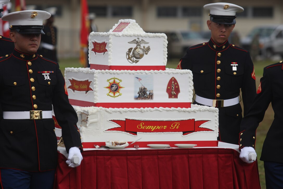 The ceremonial birthday cake is guided across the field during the 2011 Joint Daytime Ceremony aboard Marine Corps Base Camp Lejeune, Nov. 9. Showcasing a cake-cutting ceremony amidst columns of Marines in a multitude of uniforms spanning the centirues since 1775, service members and civilians alike were treated to a succinct telling of the Marine Corps' history.