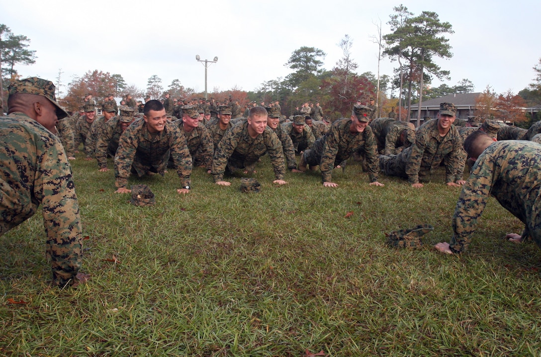 Marines with Combat Logistics Battalion 2, Combat Logistics Regiment 2, 2nd Marine Logistics Group do planks after a six-mile hike during a birthday celebration aboard Camp Lejeune, N.C., Nov. 9, 2011.  After the physical training, the Marines enjoyed a traditional cake cutting ceremony to celebrate the Marine Corps’ 236th birthday. (Photo by Cpl. Bruno J. Bego)