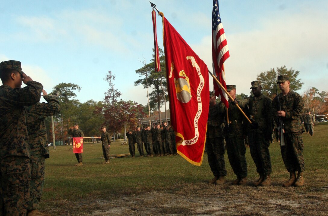 Marines with Combat Logistics Battalion 2, Combat Logistics Regiment 2, 2nd Marine Logistics Group salute the American flag while the national anthem plays during a cake cutting ceremony aboard Camp Lejeune, N.C., Nov. 9, 2011.  After a six-mile hike and other physical training exercises, the Marines enjoyed a traditional cake cutting ceremony to celebrate the Marine Corps’ 236th birthday. (Photo by Cpl. Bruno J. Bego)