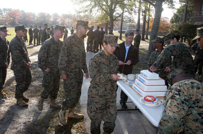 Marines with Combat Logistics Battalion 2, Combat Logistics Regiment 2, 2nd Marine Logistics Group stand in line during a cake cutting ceremony aboard Camp Lejeune, N.C., Nov. 9, 2011.  After a six-mile hike and other physical training exercises, the Marines enjoyed a traditional cake cutting ceremony to celebrate the Marine Corps’ 236th birthday. (Photo by Cpl. Bruno J. Bego)