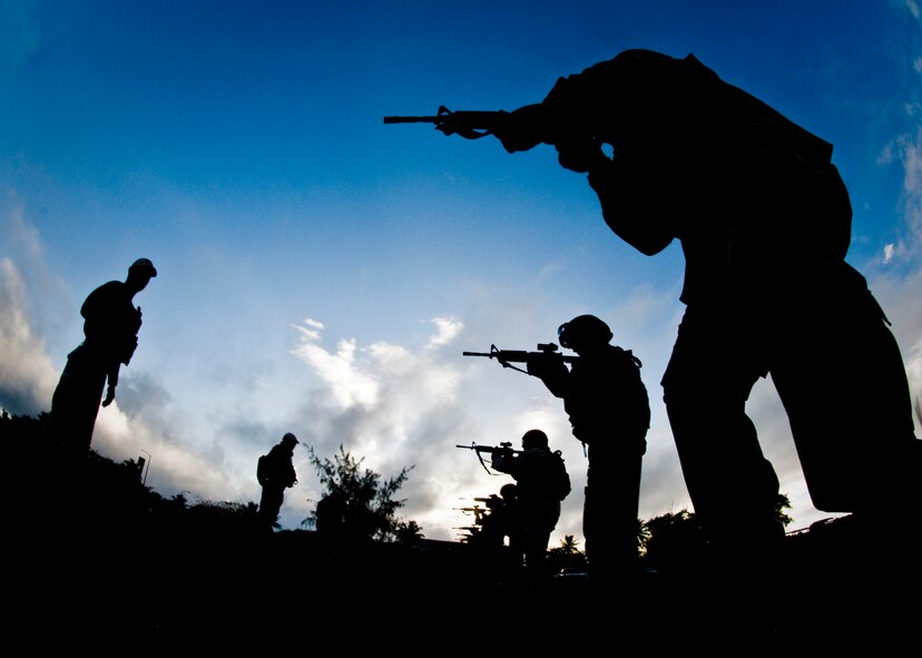 ANDERSEN AIR FORCE BASE, Guam—A line of frontline defenders prepare to fire simulated rounds at targets during the advanced weapons tactics portion of a Pacific Air Force Regional Training Center training course here, Nov. 7. The defenders trained for several hours a day to ensure they were prepared to deploy. (U.S. Air Force photo by Senior Airman Benjamin Wiseman/Released)