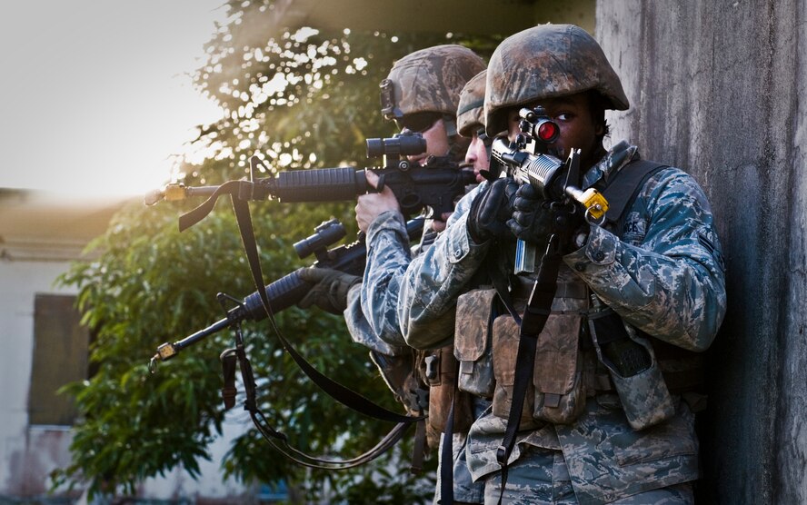 ANDERSEN AIR FORCE BASE, Guam— A fire team prepares to raid a house during training at the Pacific Air Forces Regional Training Center here, Nov. 7.  Throughout the year, the 736 SFS Commando Warrior Flight trains near one thousand Airman and joint service personnel from all around the Pacific region. (U.S. Air Force photo by Senior Airman Benjamin Wiseman/Released)