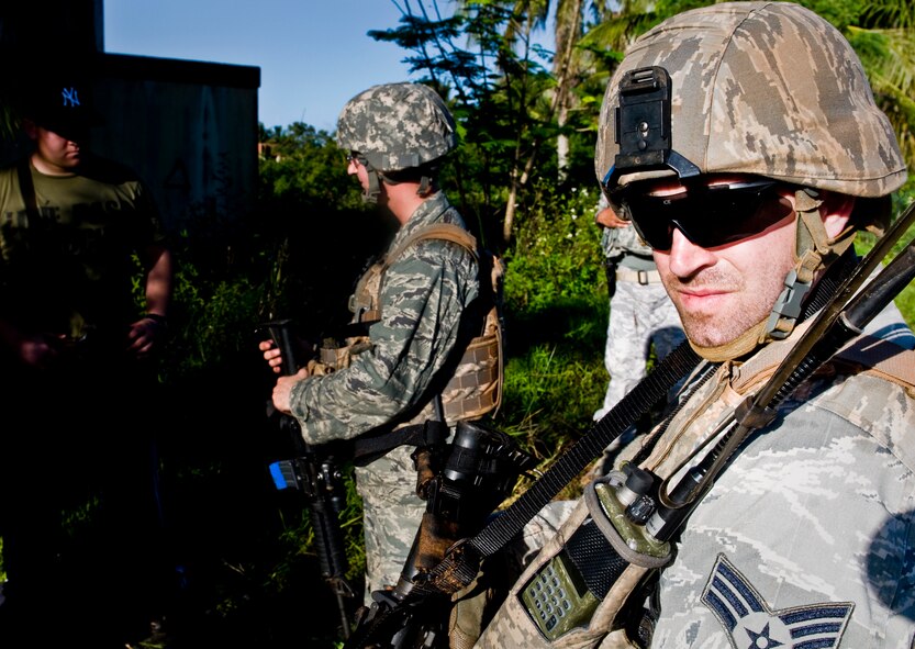 ANDERSEN AIR FORCE BASE, Guam— Senior Airman John Mizerak (right), 35th Security Forces Squadron member from Misawa Air Base, Japan, stands guard during a training scenario held at the Pacific Air Forces Regional Training Center here, Nov. 7. Members of the 736th Security Forces Squadron Commando Warrior Flight created several different scenarios to allow participants to train for real world actions and reactions. (U.S. Air Force photo by Senior Airman Benjamin Wiseman/Released)