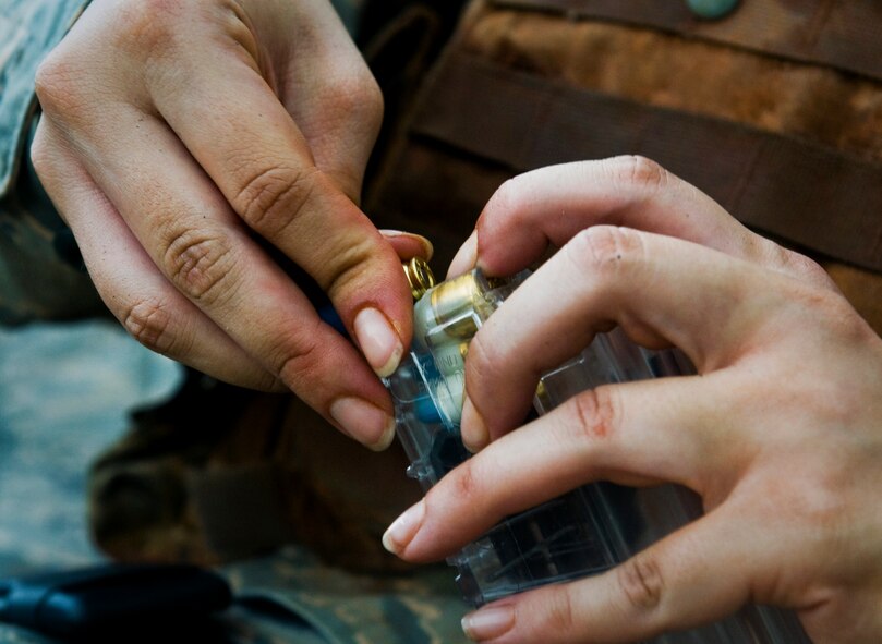 ANDERSEN AIR FORCE BASE, Guam—A security forces member loads simulated rounds into a magazine during training at the Pacific Air Forces Regional Training Center here, Nov. 7. Simulated rounds and blanks were used during the training to provide a realistic training environment.  (U.S. Air Force photo by Senior Airman Benjamin Wiseman/Released)