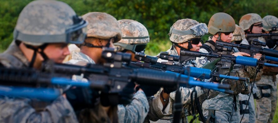 ANDERSEN AIR FORCE BASE, Guam—A line of frontline defenders prepare to fire simulated rounds at targets during training at the Pacific Air Forces Regional Training Center here, Nov. 7. The 736th Security Forces Squadron commando warrior flight is responsible for preparing frontline defenders from around the Pacific Air Force for deployment.  (U.S. Air Force photo by Senior Airman Benjamin Wiseman/Released)
