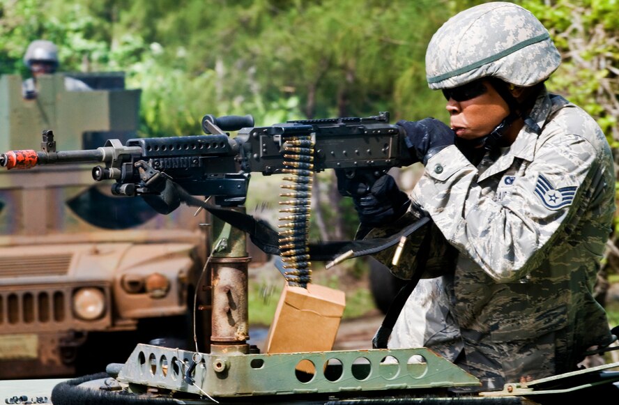 ANDERSEN AIR FORCE BASE, Guam—Staff Sgt. Sabrina Smith, 36th Security Forces Squadron team leader, fires a mounted M240 heavy machine gun during training at the Pacific Air Forces Regional Training Center training course here, Nov. 5. The course included counter improvised explosive device training, advanced tactics, convoy operations and navigational training. (U.S. Air Force photo by Senior Airman Benjamin Wiseman/Released)