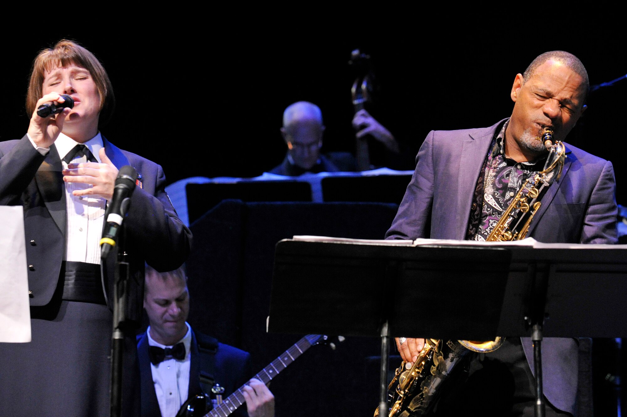 Saxophonist Kirk Whalum and Tech. Sgt. Paige Martin share the stage during a Jazz Heritage Series performance featuring the USAF Airmen of Note on November 4, 2011 at The George Washington University in Washington, D.C.