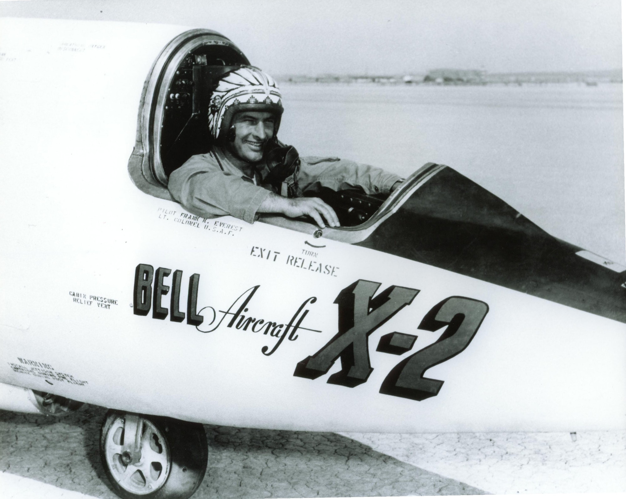 Lt. Col. Frank K. “Pete” Everest, Chief of the Flight Test Operations Division at Edwards from 1950-1956, shown here in the rocket-powered Bell X 2 research aircraft. Colonel Everest made the first powered flight of the X 2 on November 18, 1955, and completed eight of the nine total powered X-2 flights. Everest’s status as the “Chief” of Air Force flight test was denoted by the headdress painted on his helmet. (Photo courtesy of AFFTC History Office) 