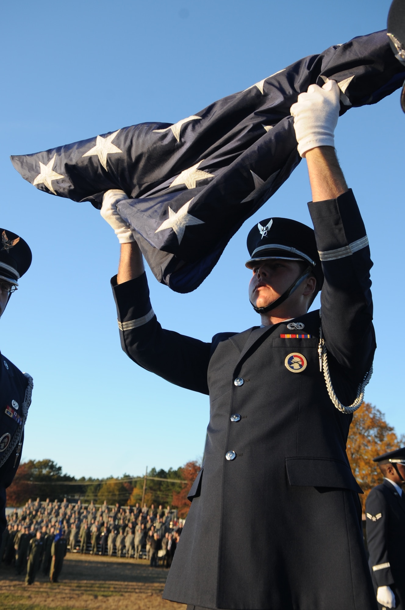 Honor Guard members prepare the flag for inspection during the Veterans Day retreat ceremony Nov. 9, 2011, at Little Rock Air Force Base, Ark. The retreat, held at Heritage Park on base, commemorated the end of the duty-day, and paid homage to all veterans who’ve made sacrifices to serve in the United States military. (U.S. Air Force photo by Staff Sgt. Jim Araos)