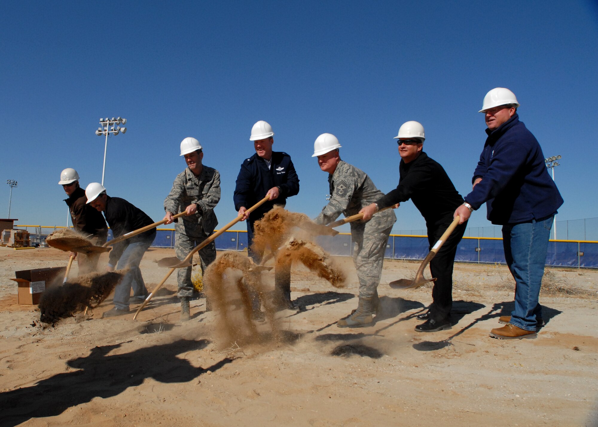 From left: Stan Simmons, ACE Engineering contractor; Joe Hunt, 95th Civil Engineering Division; Col. Gregory Schwab, 95th Air Base Wing commander; Brig. Gen. Robert C. Nolan II, Air Force Flight Test Center commander; Chief Master Sgt. Bill Thomaston, 95th ABW command chief; Carlos Bassut, 95th Force Support Squadron director; and Pete Smith, 95th FSS Edwards Fitness and Sports Center director, have the honor of breaking the first pieces of ground, Nov. 8, for a new work-out facility outside the Rosburg Fitness Center. Construction of the Sprung facility – which will house free weights and high intensity workout equipment – began Nov. 8 and is expected to be completed by June 2012. (U.S. Air Force photo/Kate Blais)