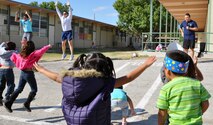 LAUGHLIN AIR FORCE BASE, Texas— Ray Torres, Laughlin Health and Wellness Center exercise physiologist, explains exercises while Mike Kearns, 47th Medical Group Aerospace Physiology, demonstrates. The exercises and fun were part of Cardwell Elementary School’s fitness days Nov. 8 and Nov. 9. (U.S. Air Force photo/2nd Lt. James Ramirez)