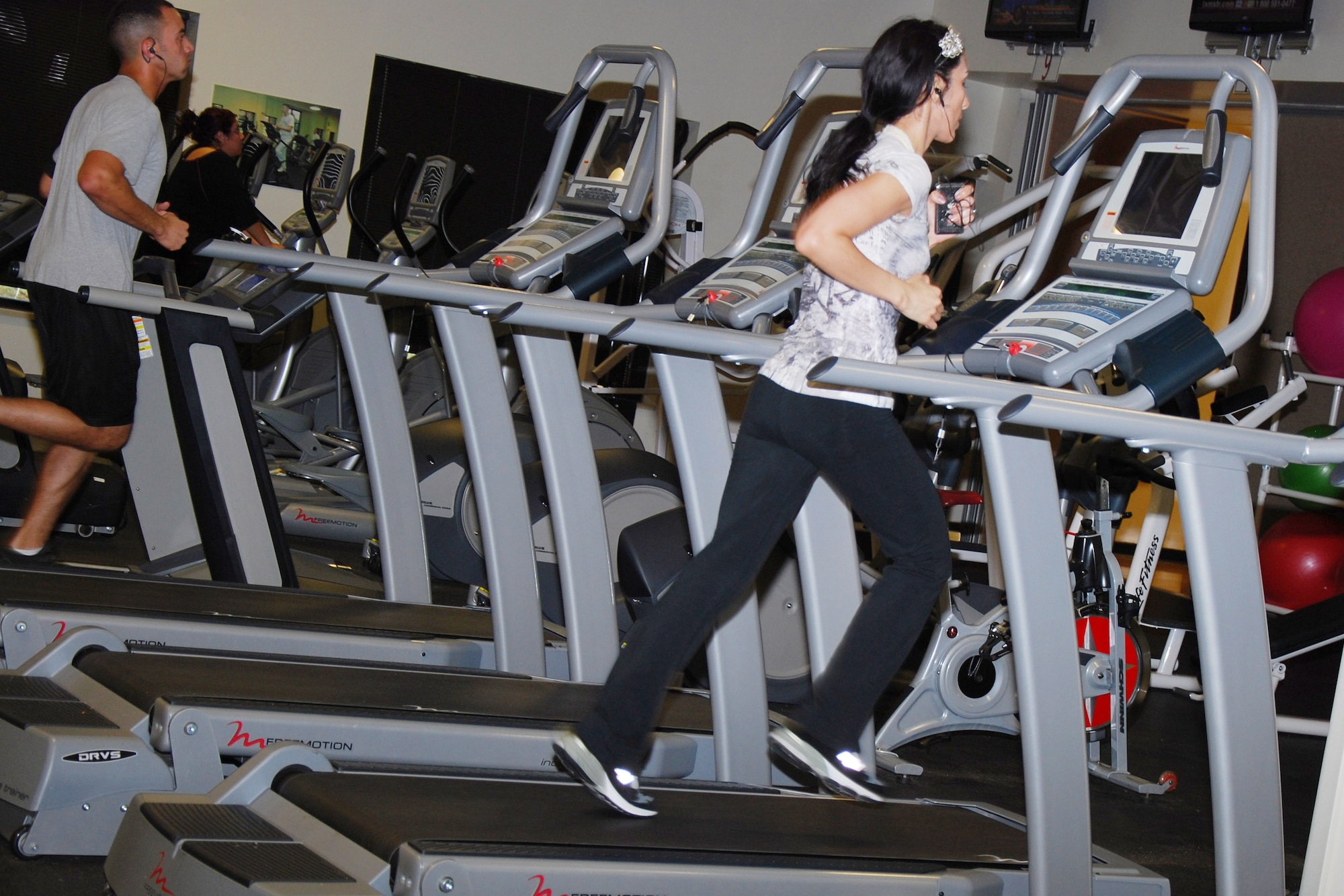 A Sheppard member runs on one of the gym’s new treadmills at Pitsenbarger Fitness Center, Sheppard Air Force Base, Texas, Nov. 8, 2011; an old treadmill can be seen in the background. Gym equipment at Pitsenbarger and Levitow fitness centers is being replaced in a five-phase process that began in September and will conclude in December. (U.S. Air Force photo/Capt. Brittany Martin)