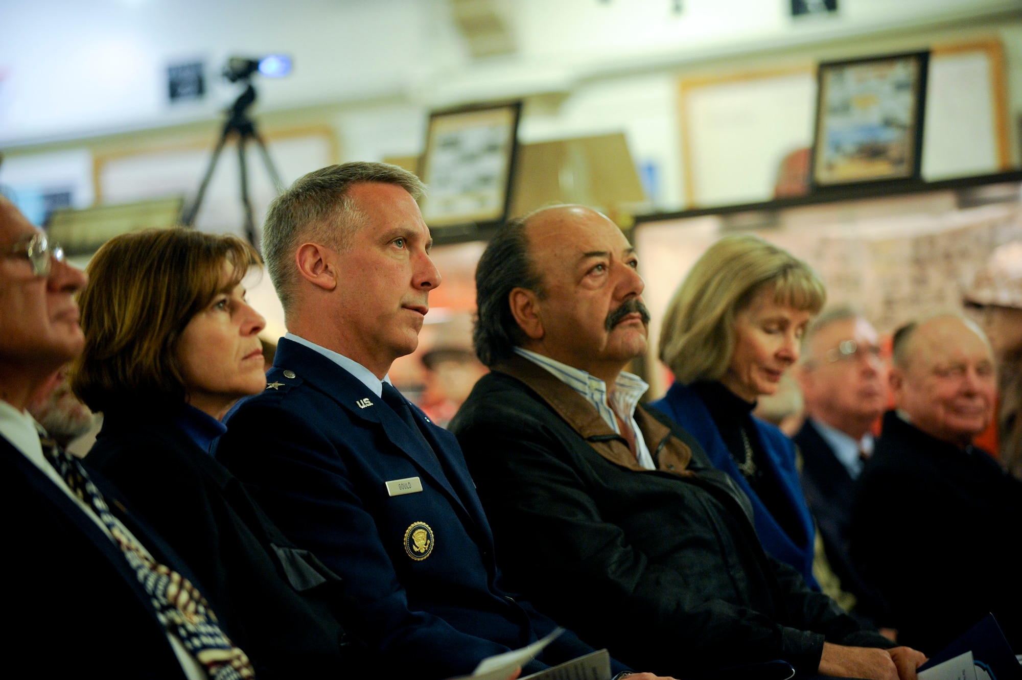 VANDENBERG AIR FORCE BASE, Calif. -- Brig. Gen. Thomas Gould, 14th Air Force vice commander, listens as guest speaker introduce the Central Coast Veterans Memorial Museums newest display which includes Gen. Hoyt S. Vandenberg's uniform, medals and other memorabilia in San Luis Obispo, Calif., Tuesday, November 8, 2011. Maj. Gen. Hoyt S. Vandenberg Jr. donated his father's uniform items to the Vandenberg chapter of the Military Order of World War who then loaned the items to the museum for permanent display. Gen. Vandenberg was the Air Force's second Chief of Staff, is known for officially authorizing the Air Force's blue service dress and has Vandenberg Air Force Base named after him. (U.S. Air Force photo/Staff Sgt. Levi Riendeau)
