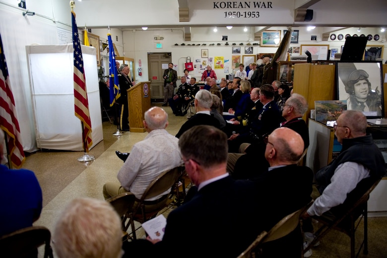 VANDENBERG AIR FORCE BASE, Calif. -- Retired Army Col. Jack Jones, Central Coast Veterans Memorial Museum president, introduces the museum's newest display which includes Gen. Hoyt S. Vandenberg's uniform, his medals and other memorabilia at the museum in San Luis Obispo, Calif., Tuesday, Nov. 8, 2011. Maj. Gen. Hoyt S. Vandenberg Jr. donated his father's uniform items to the Vandenberg chapter of the Military Order of World War who then loaned the items to the museum for permanent display. Gen. Vandenberg was the Air Force's second Chief of Staff, is known for officially authorizing the Air Force's blue service dress and has Vandenberg Air Force Base named after him. (U.S. Air Force photo/Staff Sgt. Levi Riendeau)
