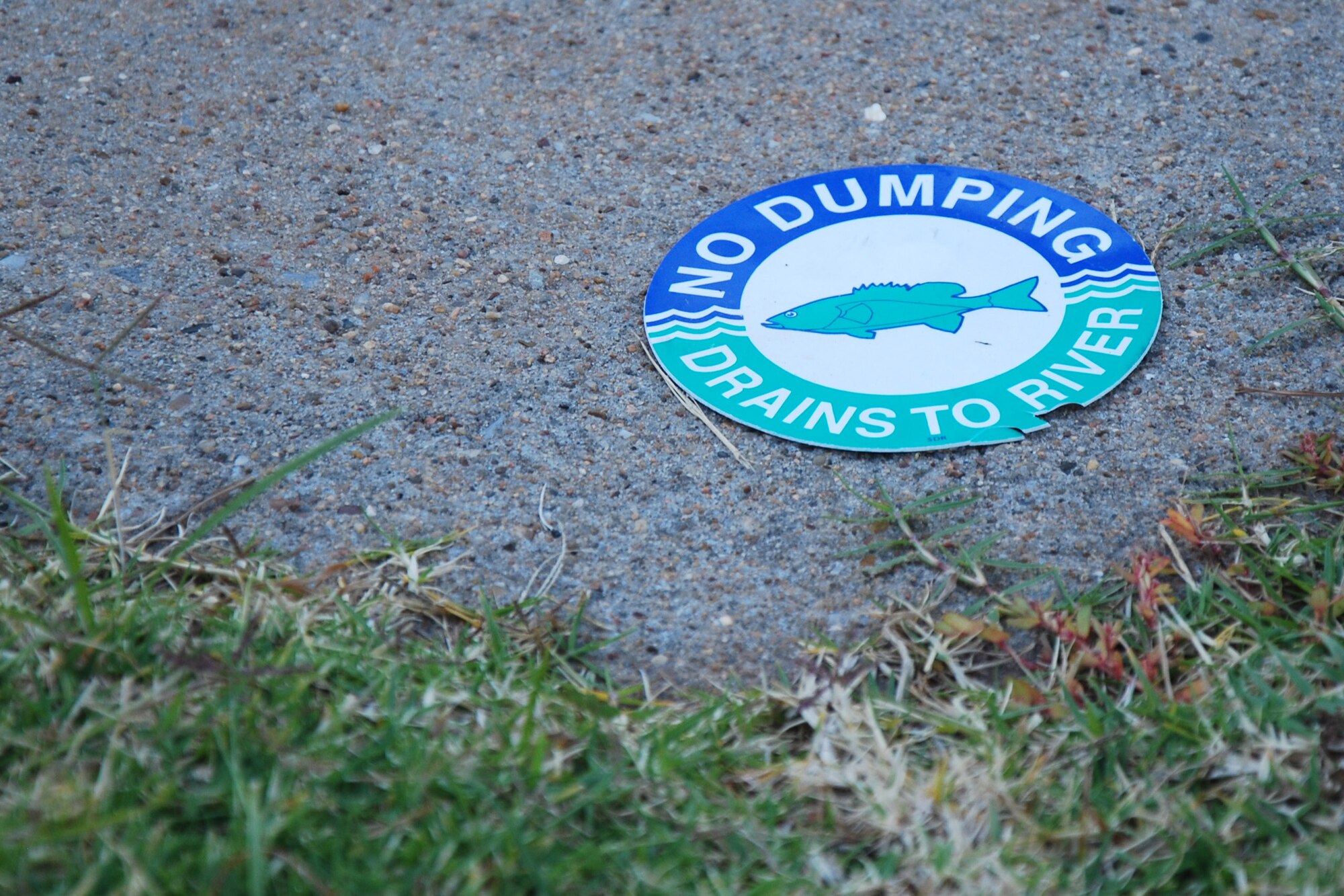 Sheppard Air Force Base marks drains to ensure base personnel do not unintentionally pollute the river, just one of many measures taken to protect the environment. The Texas Commission on Environmental Quality has recognized Sheppard as a platinum member in the Clean Texas program since April 2009. (U.S. Air Force photo/Capt. Brittany Martin)