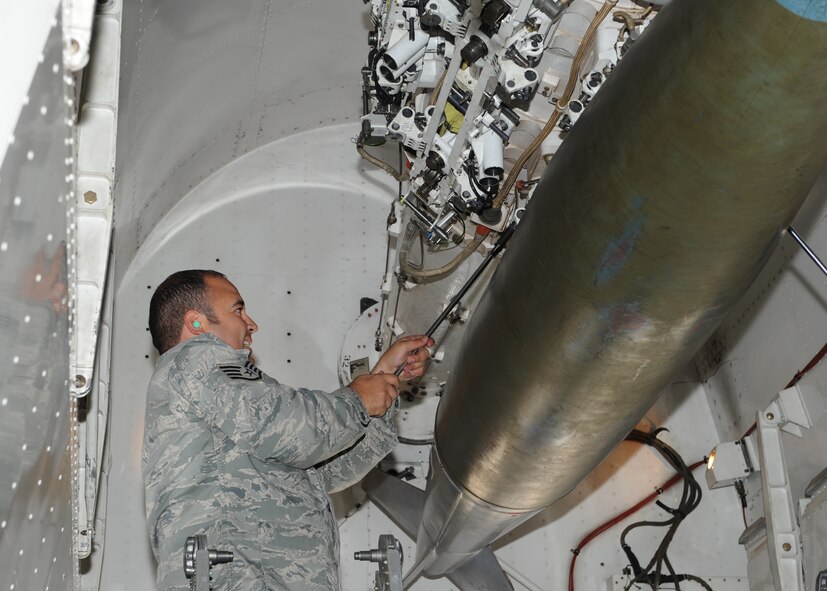 Staff Sgt. Ted Moreno, 7th Aircraft Maintenance Squadron, locks a Mark-84 onto a rotary launcher Nov. 9, 2011 during a proficiency load exercise at Dyess Air Force Base, Texas. Exercises are conducted monthly to keep airmen qualified to load different munitions. (U.S. Air Force photo by Airman 1st Class Jonathan Stefanko/ Released)