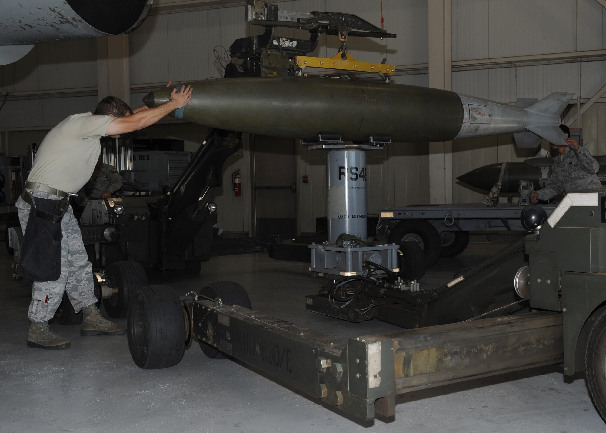 Staff Sgt. Timothy Sevigny, 7th Aircraft Maintenance Squadron, prepares a Mark-84 for loading Nov. 9, 2011 during a proficiency load exercise at Dyess Air Force Base, Texas. Exercises conducted monthly to keep airmen qualified to load different munitions. (U.S. Air Force photo by Airman 1st Class Jonathan Stefanko/ Released)