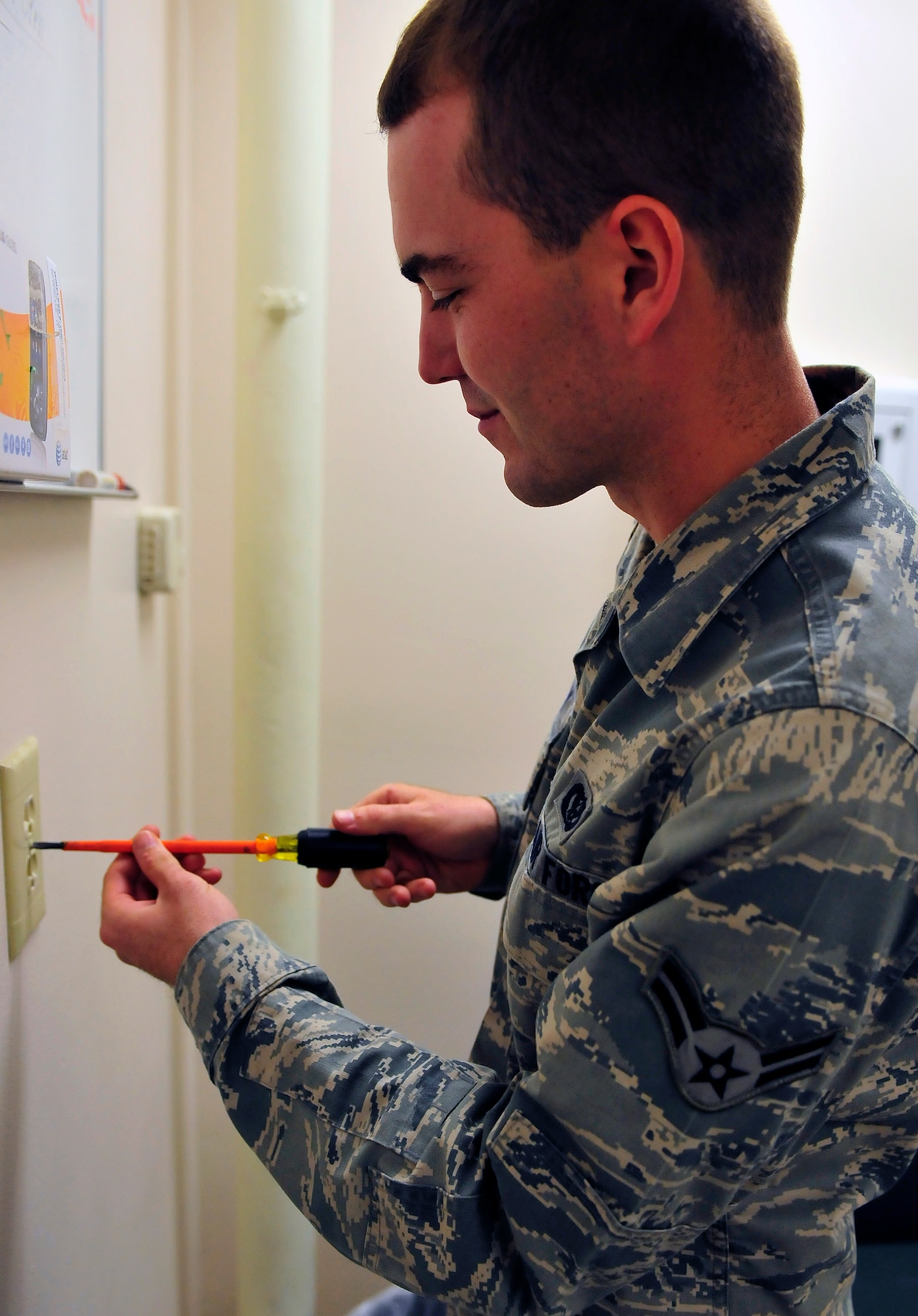 Airman 1st Class Jeffrey Empson, 20th Civil Engineer Squadron electrician, works on an electrical outlet at Shaw Air Force Base, S.C., Nov. 9, 2011. Empson is the Warrior of the Week for the week of  7 through 11. (U.S. Air Force photo/Airman 1st Class Daniel Phelps/Released)