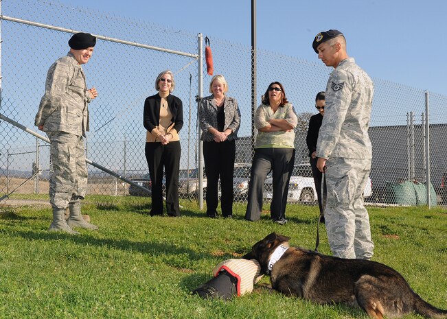 Staff Sgt. Christopher La Boy (right), 9th Security Forces Squadron military working dog handler, explains military working dog techniques to Kathy Hostage and key spouses of Beale Air Force Base, Calif., during a demonstration, Nov. 7, 2011.  Beale currently has eight military working dogs and 12 handlers. (U.S. Air Force photo by Chandresh V. Bhakta/Released)