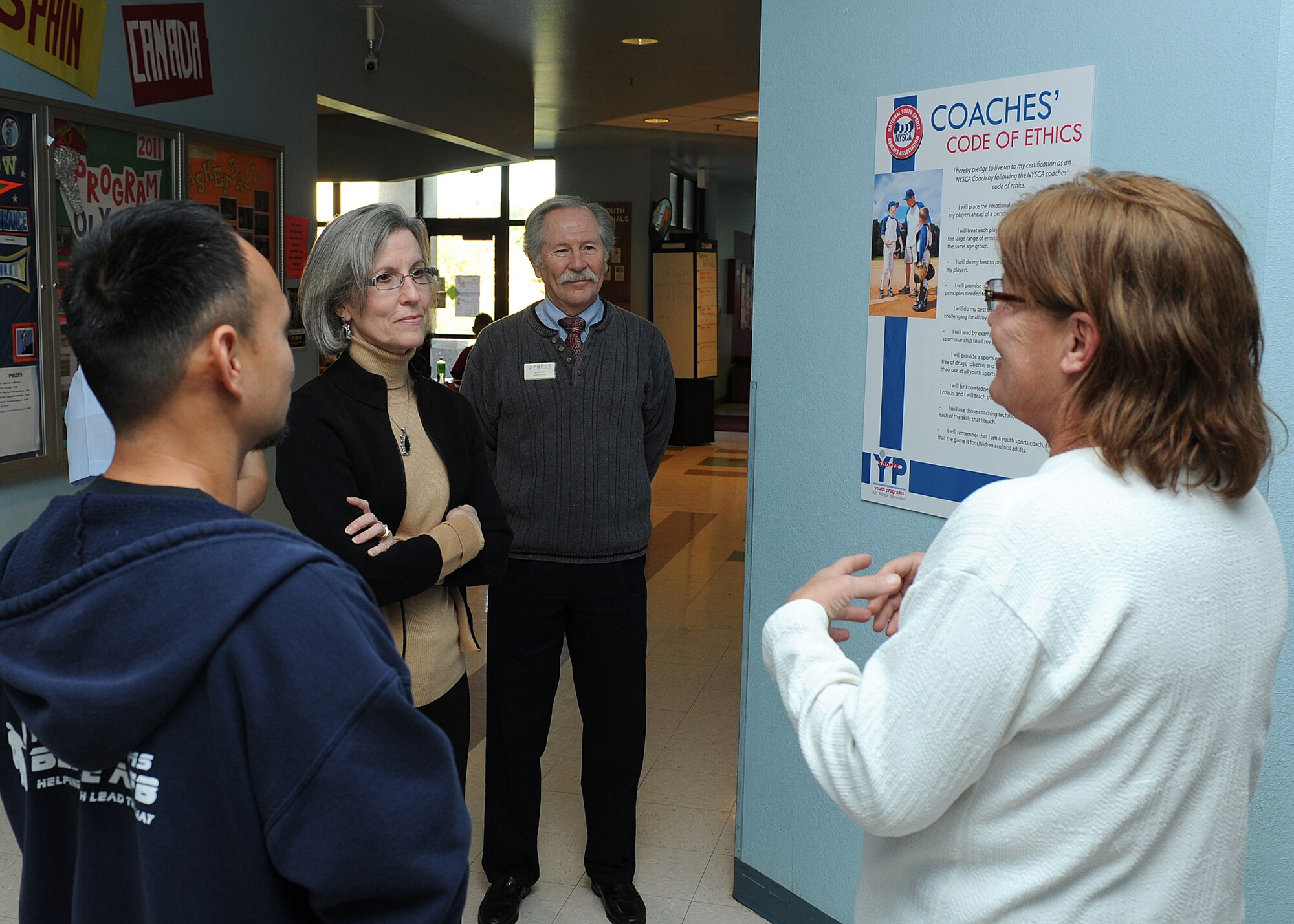 Sue Galmish (far right), 9th Force Support Squadron (9th FSS) youth center director, and Clarome Teria (far left), 9th FSS youth programs teen coordinator, explains the youth sports program to Kathy Hostage, wife of General Gilmary Michael Hostage III, commander of Air Combat Command, and Mr. Bill Baltzell, 9th FSS deputy commander, during Ms. Hostage’s visit to Beale AFB, Calif. November 7 2011.  Beale Youth Center supports approximately 225 kids. (U.S. Air Force photo by Chandresh V. Bhakta/Released)