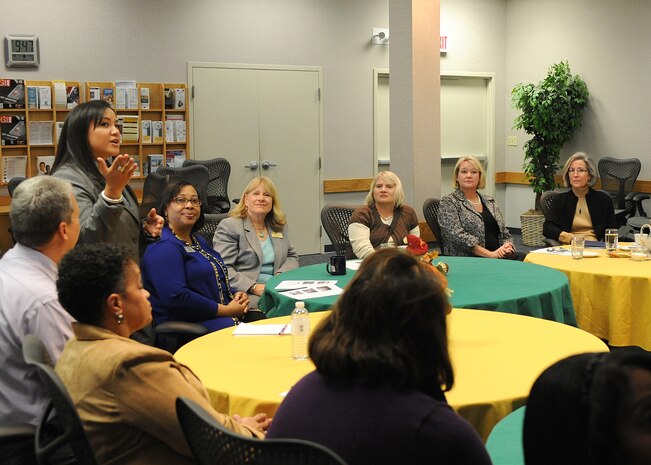 Keri Merski, 9th Force Support Squadron community readiness specialist, briefs Kathy Hostage (far right) on resilience training, a briefing normally given during the First Term Airman Course at the Airman and Family Readiness Center, Beale Air Force Base, Calif., Nov. 7, 2011.  Mrs. Hostage visited Beale with her husband, Gen. Mike Hostage, commander of Air Combat Command, to meet with wing members and gain a better understanding of the mission. (U.S. Air Force photo by Chandresh V. Bhakta/Released)