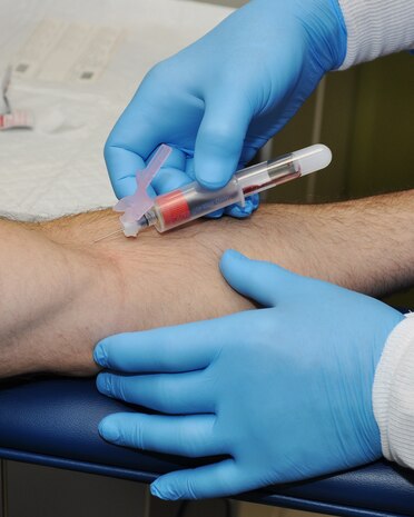 Donald Jessup, 9th Medical Support Squadron (MDSS) phlebotomist, draws blood from Maj. Gantry Griffin, mission liasons officer for the Air Force Acedemy, at Beale Air Force Base, Calif., Nov. 9, 2011.  The 9th MDSS gathers blood samples for a number of reasons such as HIV and cholesteral testing.  (U.S. Air Force photo by Staff Sgt. Jonathan Fowler)