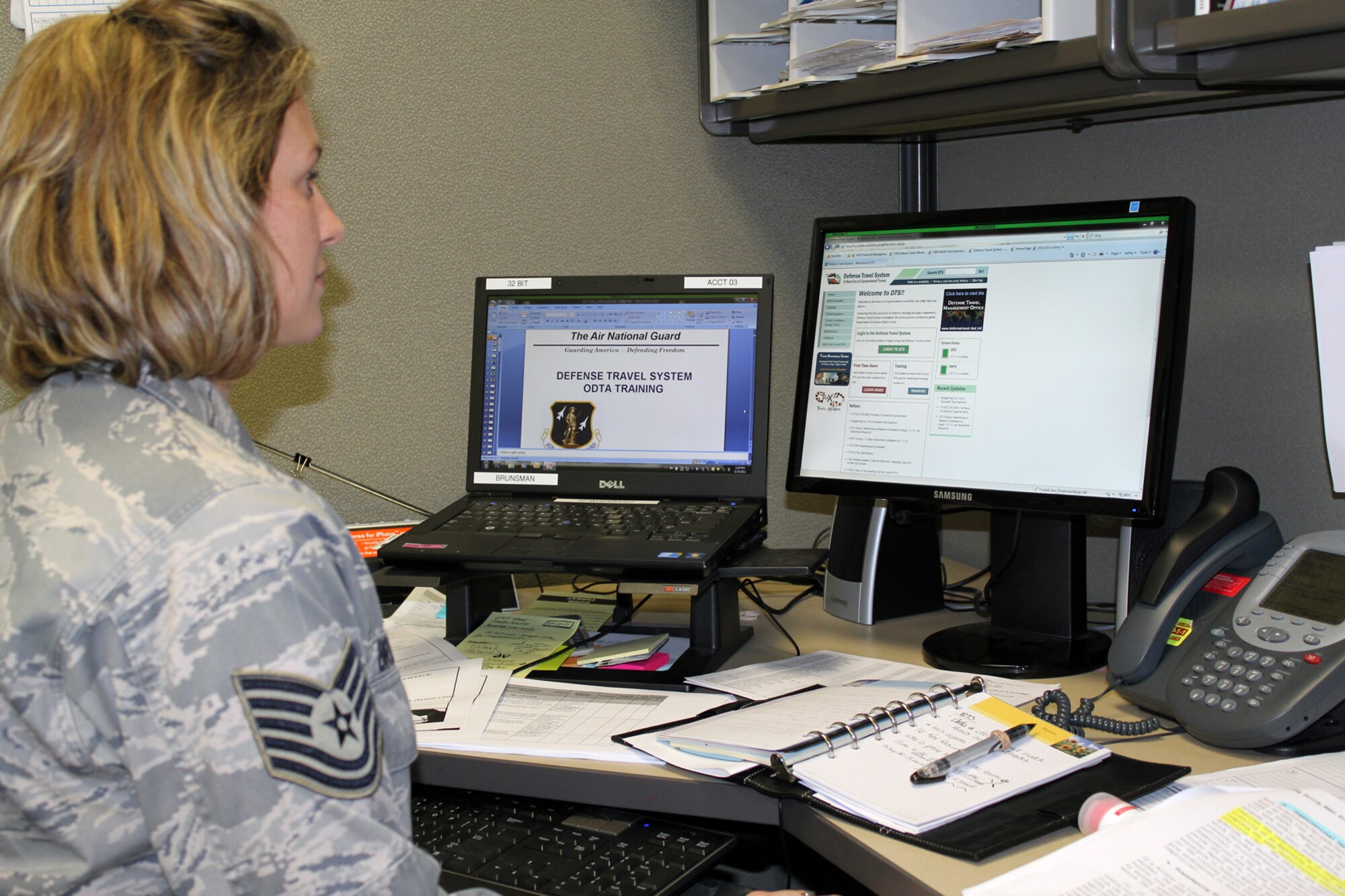 TSgt. Sarah Brunsman, a travel pay specialist in the 127th Comptroller Flight, looks at the Defense Travel System web site. All new travel claims filed by members of the 127th Wing must now be accomplished electronically through the DTS system. (U.S. Air Force photo by TSgt. Dan Heaton)