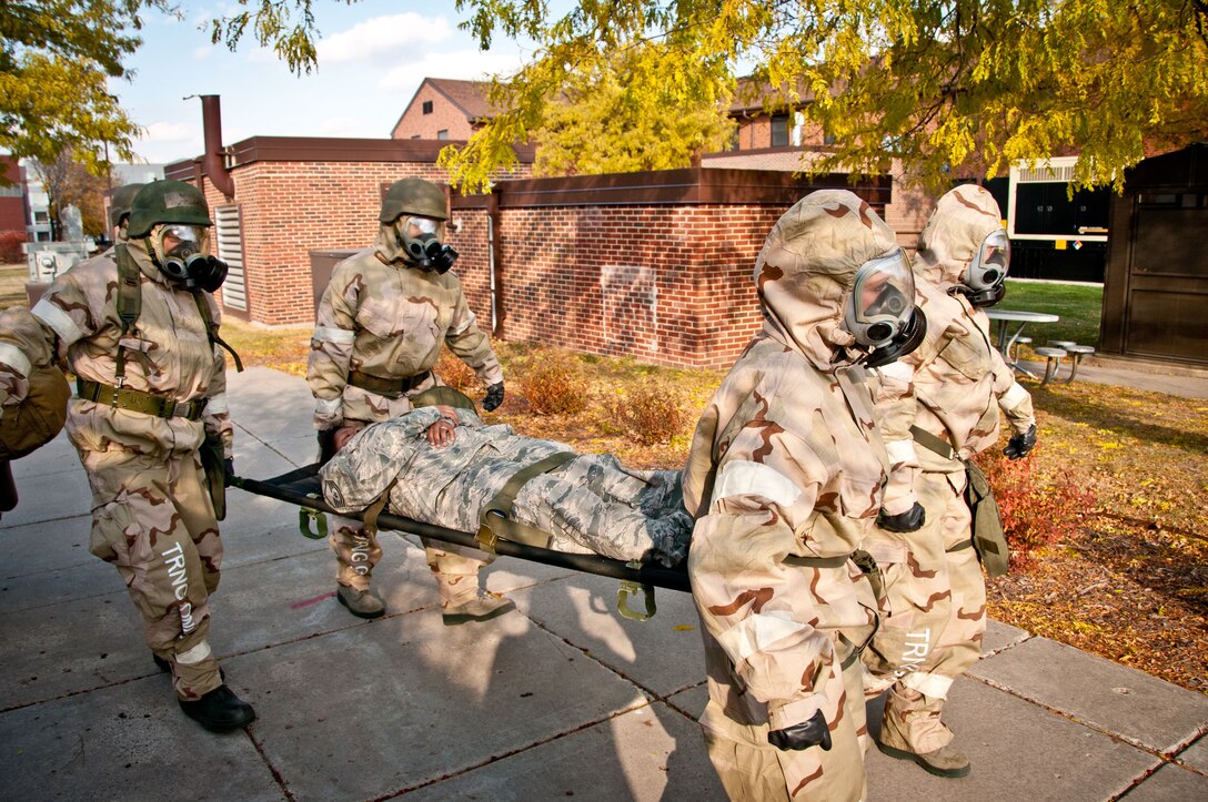 934th Airlift Wing Airmen perform duties in chemical warfare gear during a Readiness Assistance Visit Nov. 6. (Air Force Photo/Tech. Sgt. Jim Loehr)