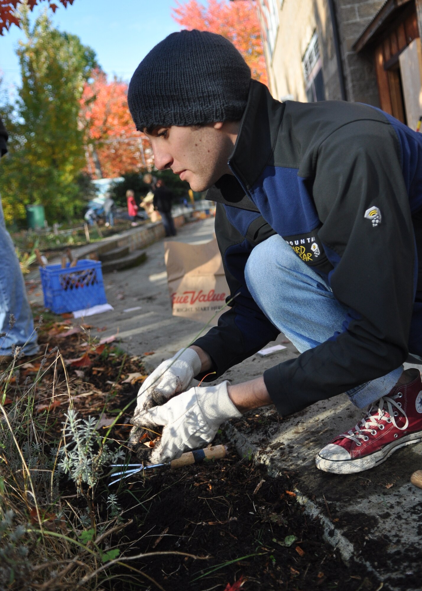 Senior Airman Michael Calderon, 8th Airlift Squadron loadmaster, weeds the Madrona School’s learning garden Nov. 5, 2011, in Seattle. “It feels good to know that a couple hours of work will give these kids a whole new place to learn,” said Calderon. (U.S. Air Force photo/Airman 1st Class Leah Young)