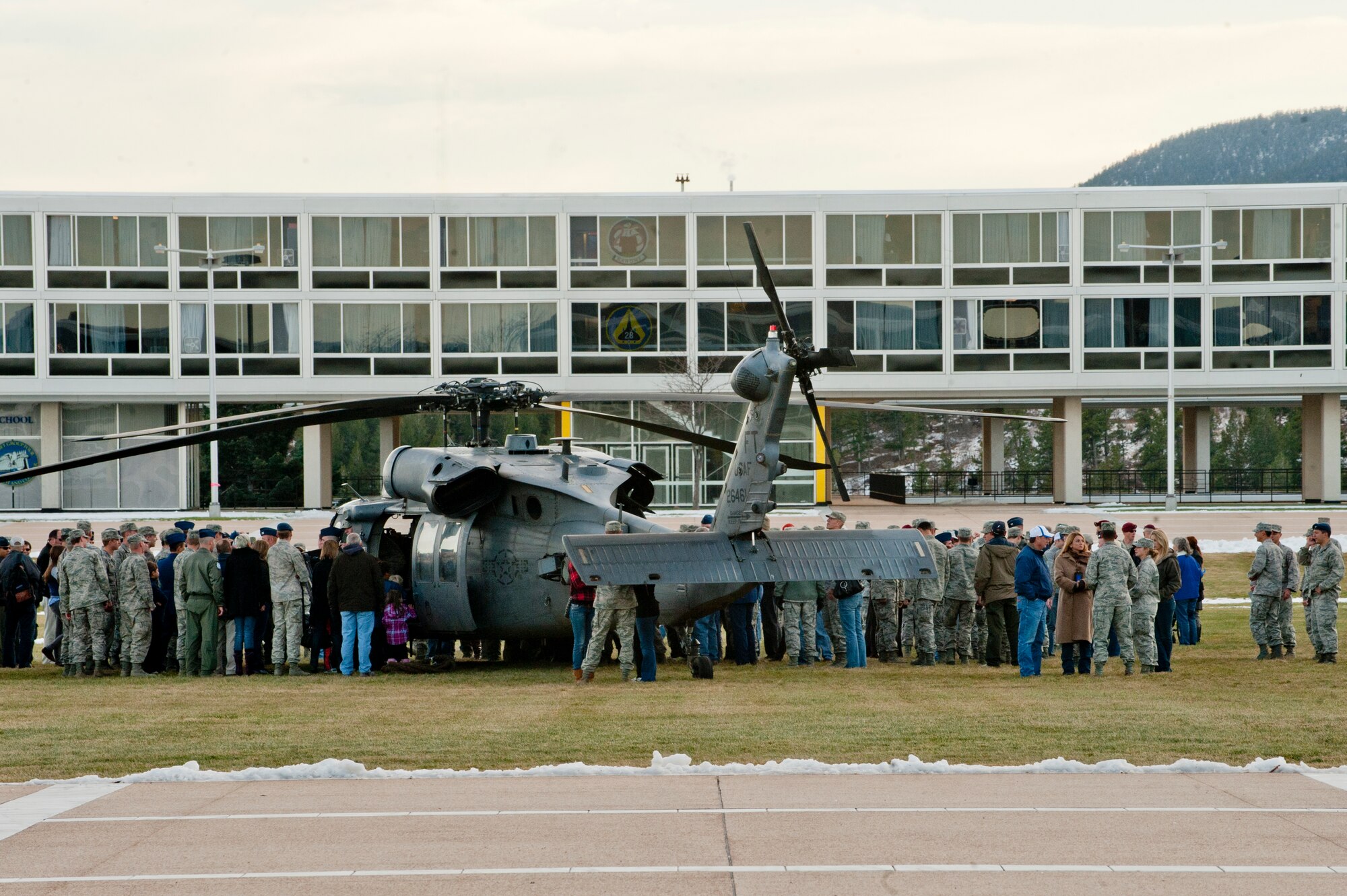 Cadets from the U.S. Air Force Academy out of Colorado Springs, Colo., gather around an HH-60G Pave Hawk to meet with pilots and pararescuemen after a personnel recovery demonstration performed by the 23rd Wing Nov. 4, 2011. The demonstration showcased the 23rd Wing's rescue capability to all in attendance. Participants in the demonstration included three medal award winners, two who received a Bronze Star Medal and one who received a Distinguished Flying Cross. The pilots and pararescuemen took photos with and fielded questions from the cadets. (U.S. Air Force photo by Staff Sgt. Joshua J. Garcia/Released)
