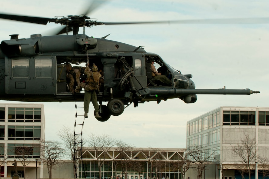 An HH-60G Pave Hawk from the 66th Rescue Squadron out of Nellis Air Force Base, Nev., 58th Rescue Squadron out of Nellis Air Force Base, Nev. a geographically separated unit (GSU) of the 23d Wing at Moody Air Force Base, Ga., hovers as a simulated downed pilot is hoisted up during a personnel recovery demonstration for the U.S. Air Force Academy in Colorado Springs, Colo., Nov. 4, 2011. The demonstration consisted of multiple squadrons from the 23rd Wing working together to secure an area and retrieve the pilot. It took under two minutes for the team to secure, retrieve, and evacuate the downed pilot. (U.S. Air Force photo by Staff Sgt. Joshua J. Garcia/Released) 