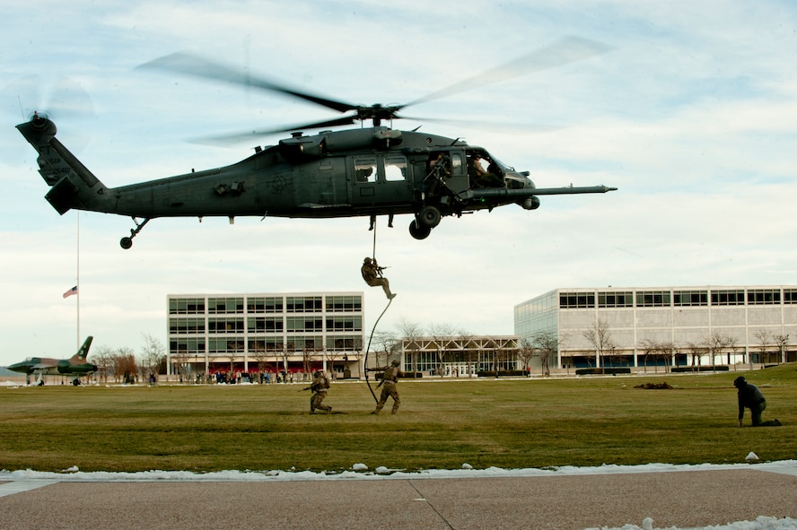 Pararescuemen from the 58th Rescue Squadron out of Nellis Air Force Base, Nev. a geographically separated unit (GSU) of the 23d Wing at Moody Air Force Base, Ga., fast rope to the ground during a personnel recovery demonstration for the U.S. Air Force Academy in Colorado Springs, Colo., Nov. 4, 2011. During the demonstration, pararescuemen secured the area and recovered downed personnel prior to evacuating the site. (U.S. Air Force photo by Staff Sgt. Joshua J. Garcia/Released)