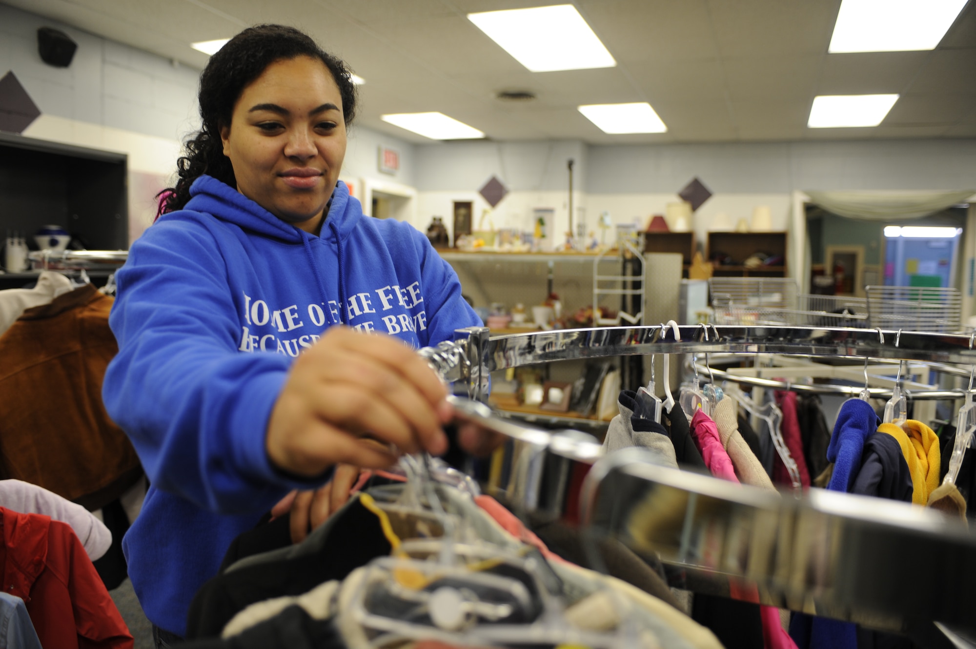 MINOT AIR FORCE BASE, N.D. -- Terra Henry, Airman’s Attic coordinator, arranges clothing as part of her volunteer duties at the Airman’s Attic. The Airman’s Attic has traditionally been a venue where Airmen and their families can go to and attain uniform attire including other miscellaneous items for free. The Airman’s Attic is open Mondays and Wednesdays from 10 a.m. to 2 p.m. and Thursdays from 5 p.m. to 7 p.m. (U.S. Air Force Photo/Airman 1st Class Jose L. Hernandez)