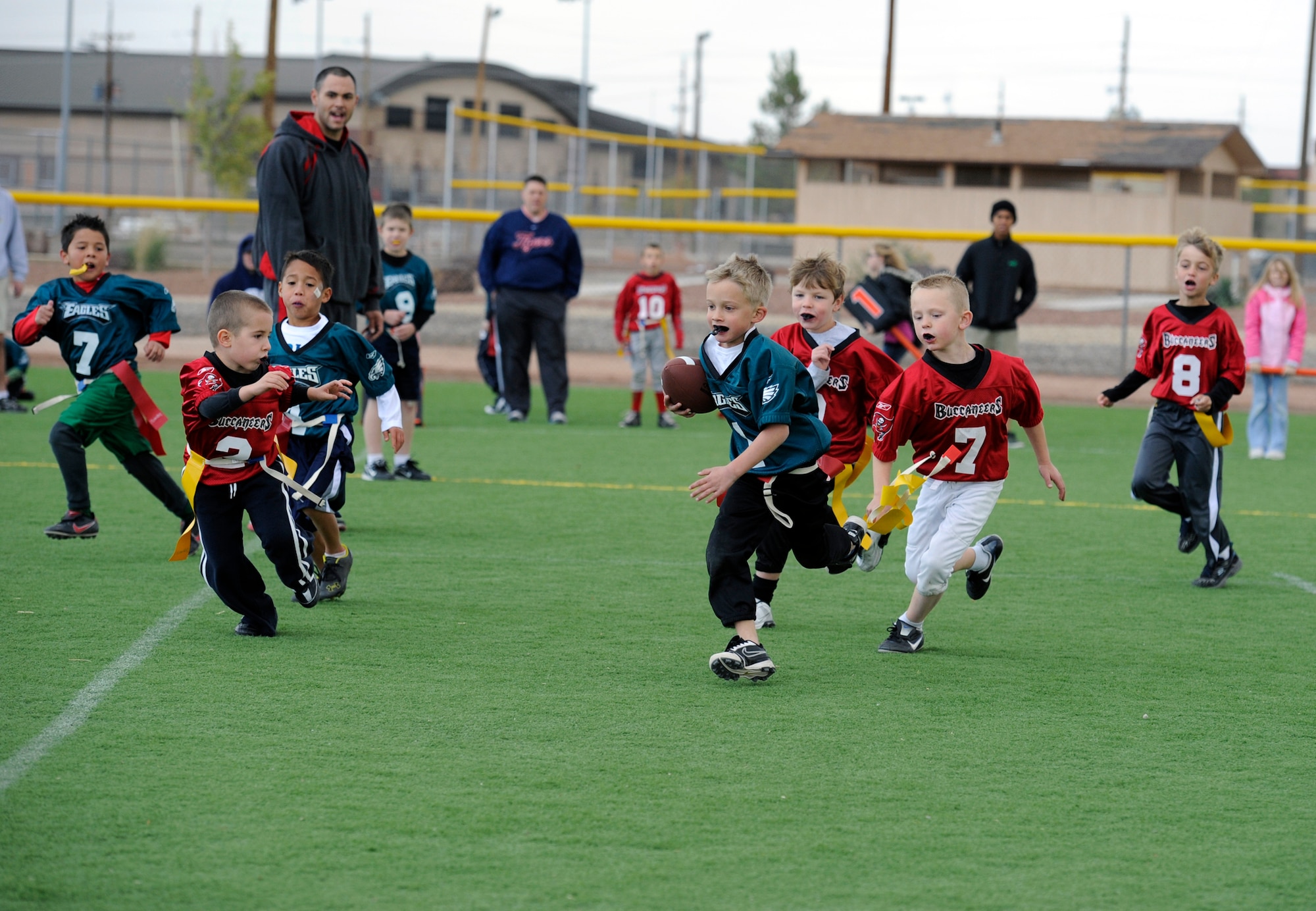 HOLLOMAN AIR FORCE BASE, N.M. -- Frank Ruepp, son of U.S. Air Force Master Sgt. Donal Ruepp, 49th Medical Group first sergeant, runs toward the end zone Nov. 5, 2011, during a game at Johnson Field. Flag football, like all of the sports offered in Holloman’s Youth Sports Program, is open to any child in the Holloman community. (U.S. Air Force photo by Airman 1st Class Siuta B. Ika/Released)