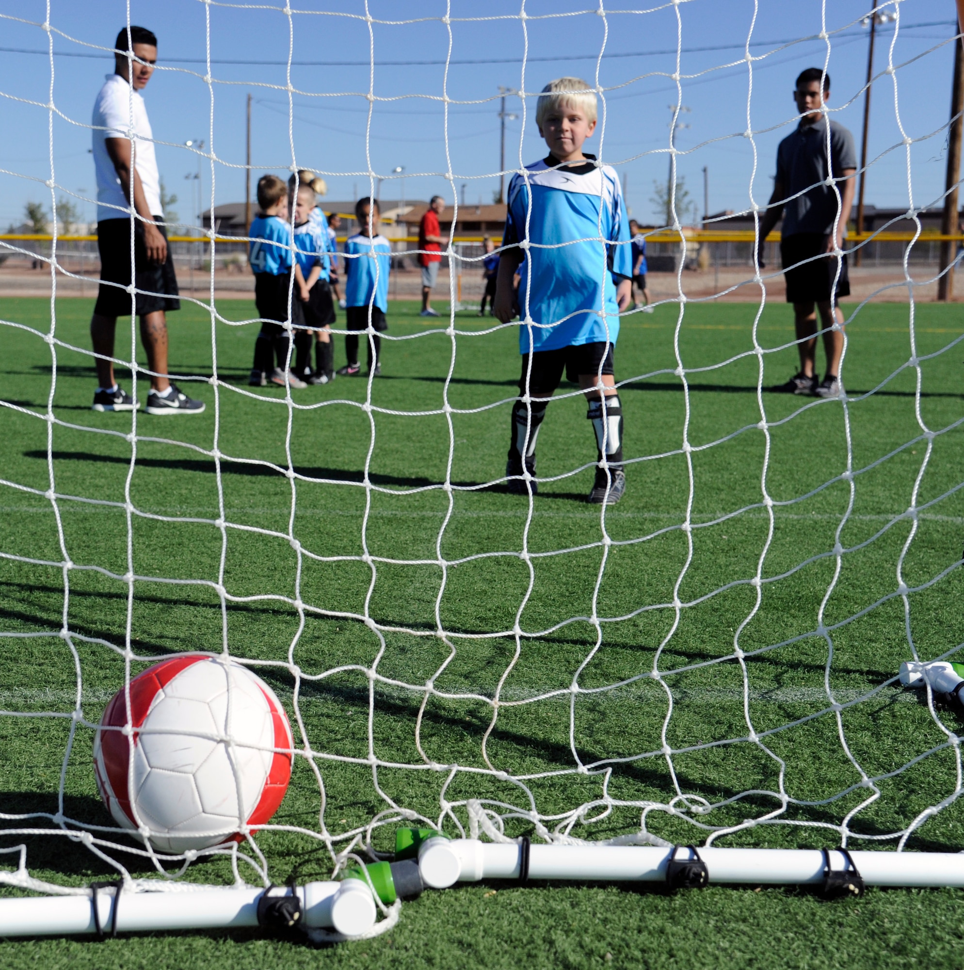 HOLLOMAN AIR FORCE BASE, N.M. -- T.J. Bengston, son of U.S. Air Force Tech. Sgt.  Christian Bengston, watches a ball go in a goal Oct. 22, 2011, during a pre-game warm-up at Johnson Field. Soccer, like all of the sports offered in Holloman’s Youth Sports Program, follows the philosophy of providing a safe, positive and fun learning experience for all of the participants. (U.S. Air Force photo by Airman 1st Class Siuta B. Ika/Released)