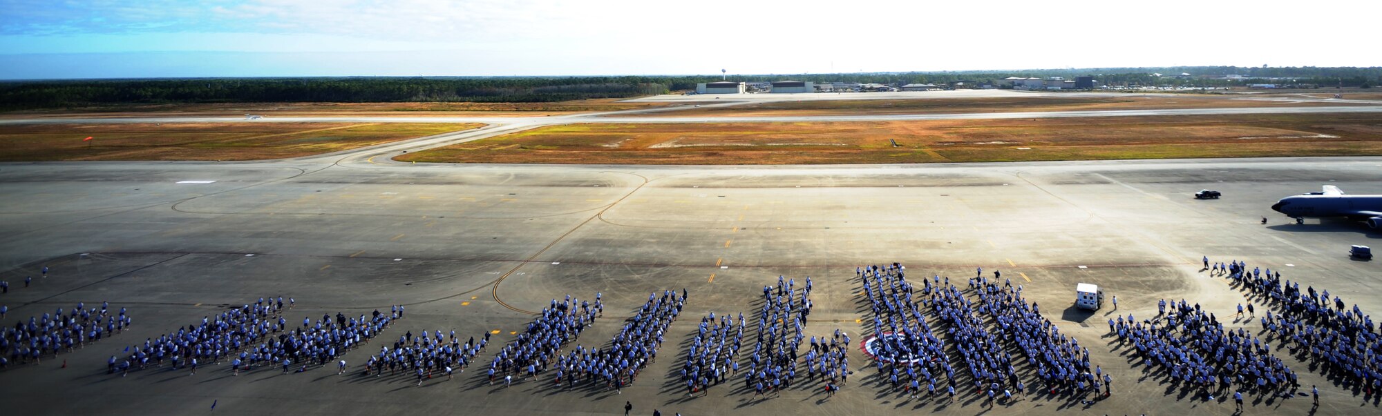 U.S. Air Force Airmen of the 1st Special Operations Wing participate in cool-down exercise and stretches after a 2.6 mile run Nov. 7, 2011 at Hurlburt Field, Fla. At the behest of 1st SOW leadership all non-critically manned Airmen participated. (U.S. Air Force photo/Senior Airman Eboni Reams)