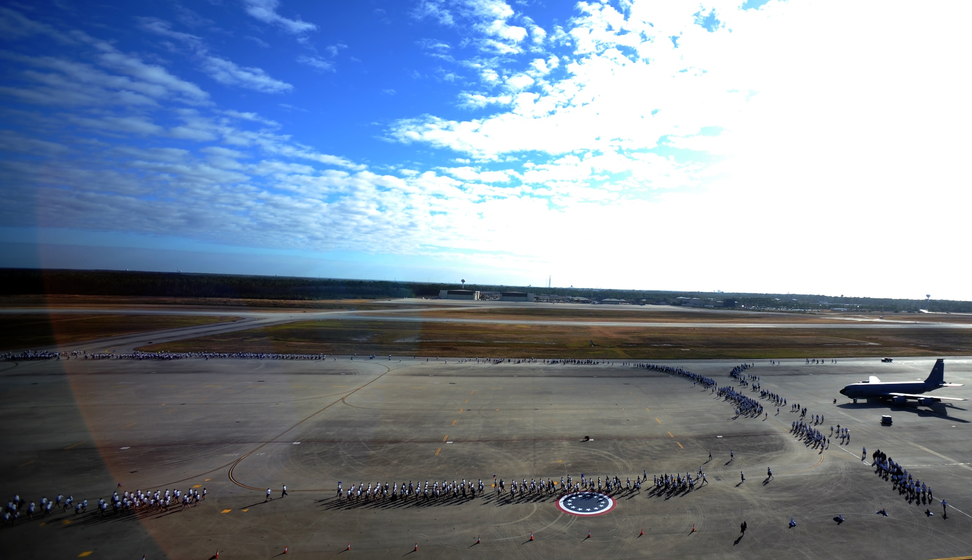 U.S. Air Force Airmen of the 1st Special Operations Wing complete a 2.6 mile wing-wide run on the flight line Nov. 7, 2011 at Hurlburt Field, Fla. The run was organized to build morale and the importance of Physical Training across the wing. (U.S. Air Force photo/Senior Airman Eboni Reams)