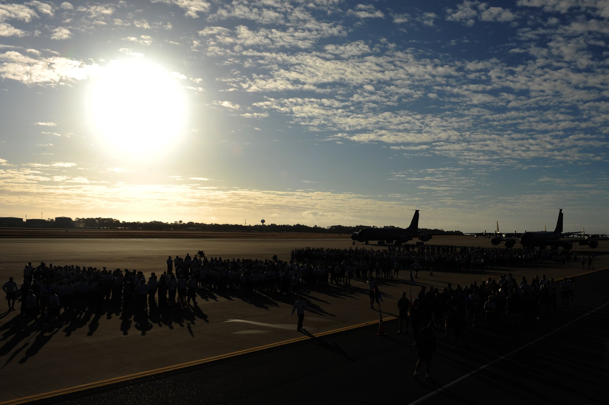 U.S. Air Force Airmen from 1st Special Operation Wing gather on the flight line to warm-up before a wing formation run Nov. 7, 2011 at Hurlburt Field, Fla. Airmen lined up by squadron and ran 2.6 miles in support of Airmen wingman day. (U.S. Air Force photo/Senior Airman Eboni Reams)