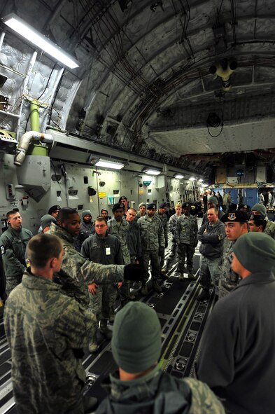 MINOT AIR FORCE BASE, N.D. -- 5th Security Forces Squadron team members tour a C-17 Globemaster III here Nov. 4. The purpose of the tour was to provide 5th SFS team members with information in preparation for an upcoming inspection. The additional training provides forces with further knowledge of the C-17 Globemaster. (U.S. Air Force Photo/Senior Airman Jesse Lopez)