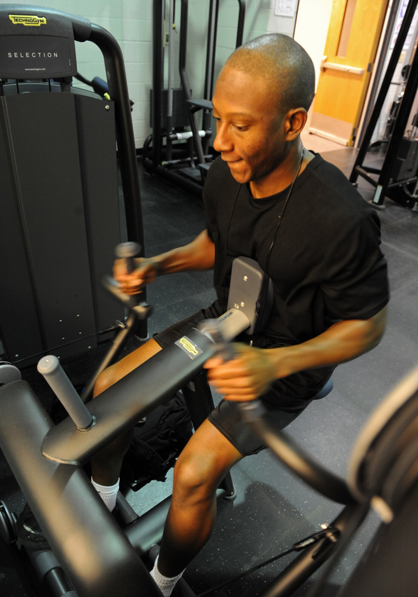 Airman 1st Class William Waitman, 7th Force Support Squadron, exercises on new equipment in the fitness center Nov. 3, 2011, at Dyess Air Force Base, Texas. The fitness center underwent renovation which includes new weights and 34 exercise machines, estimated at over $184,000. (U.S. Air Force photo by Airman 1st Class Peter Thompson/Released) 